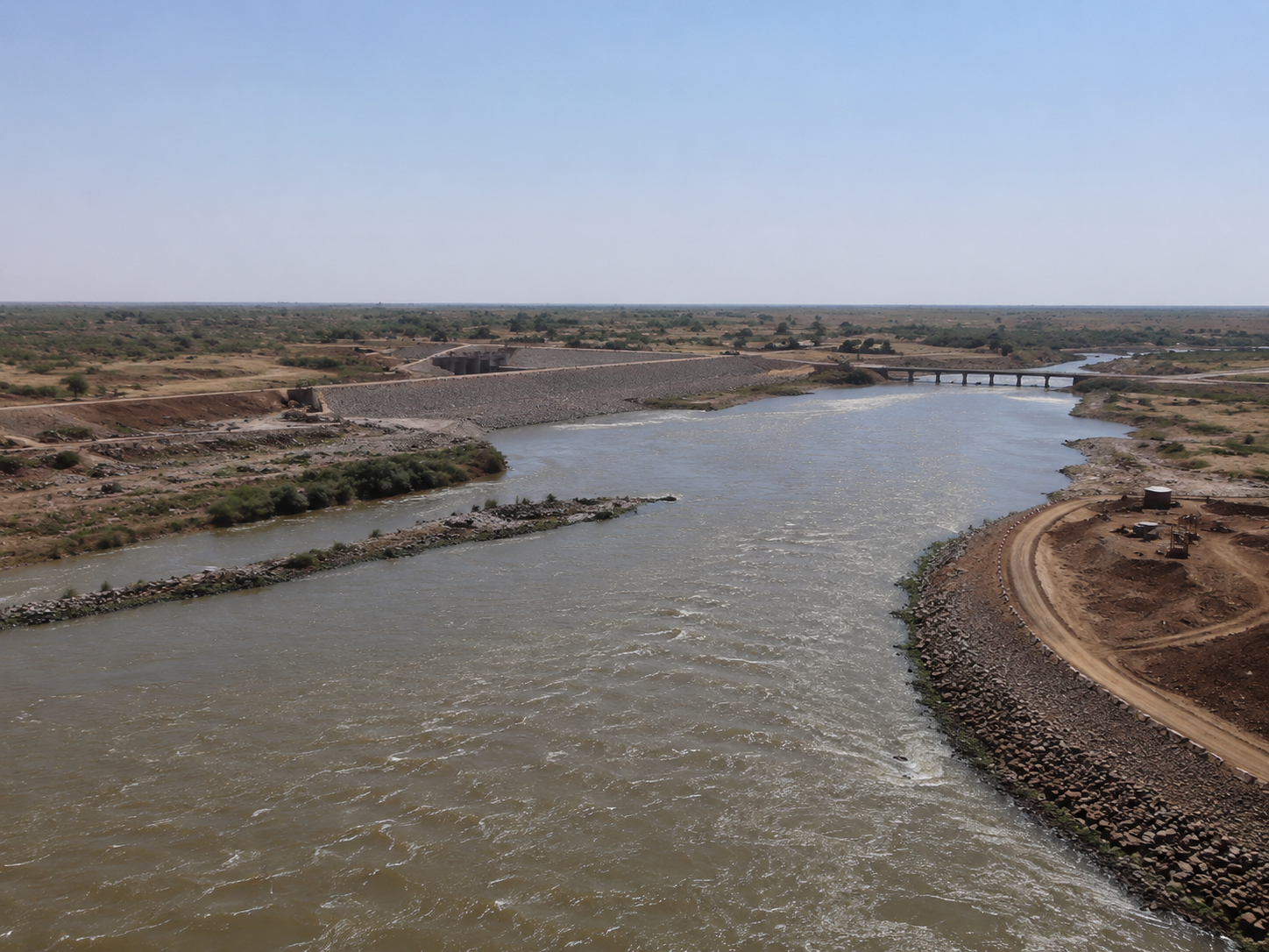 Reservoir and dam-construction landscape at Kandadji, illustrating the scale of infrastructure planned to support river regulation, irrigation expansion, and long-term water security in Niger.