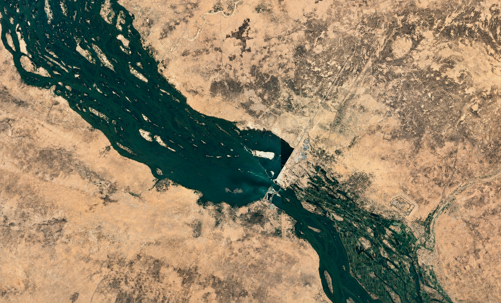 Clean satellite-style view of the Kandadji Dam area on the Niger River, showing the river corridor, Sahel landscape, reservoir zone, and downstream irrigation areas that make the project central to Niger’s water security and food resilience.