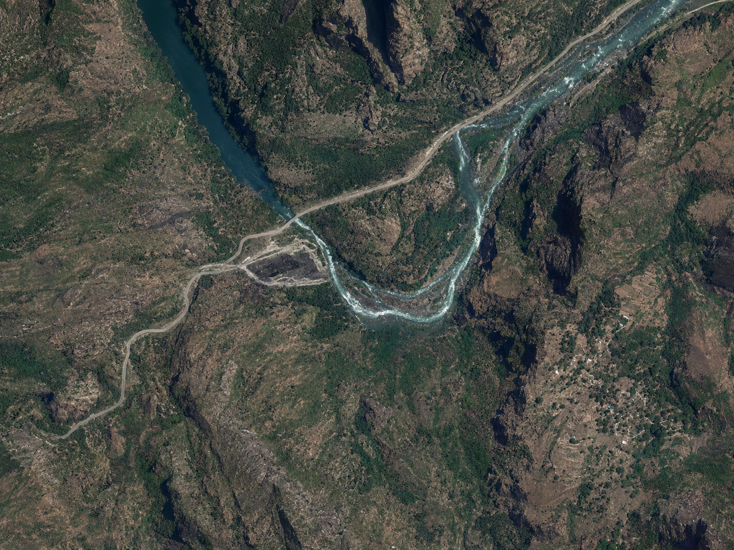Clean satellite-style view of the proposed Ruzizi III / Rusizi III hydropower site on the Ruzizi River, showing the rugged cross-border river corridor where DRC, Rwanda, and Burundi plan to share clean hydropower development.